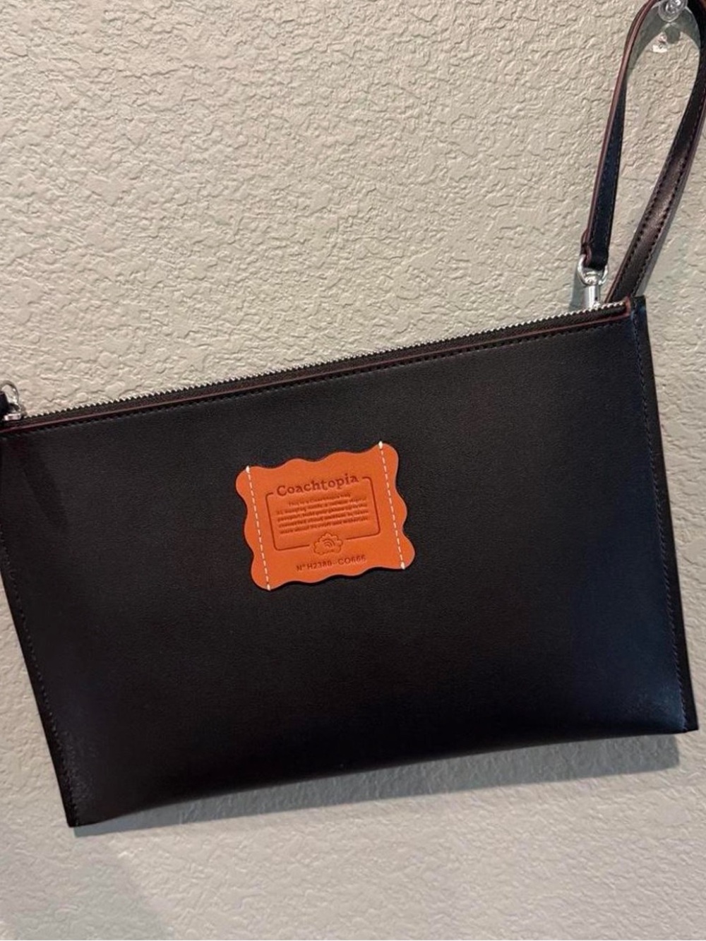 Coach Black Leather Wristlet with Orange Coachtopia Patch